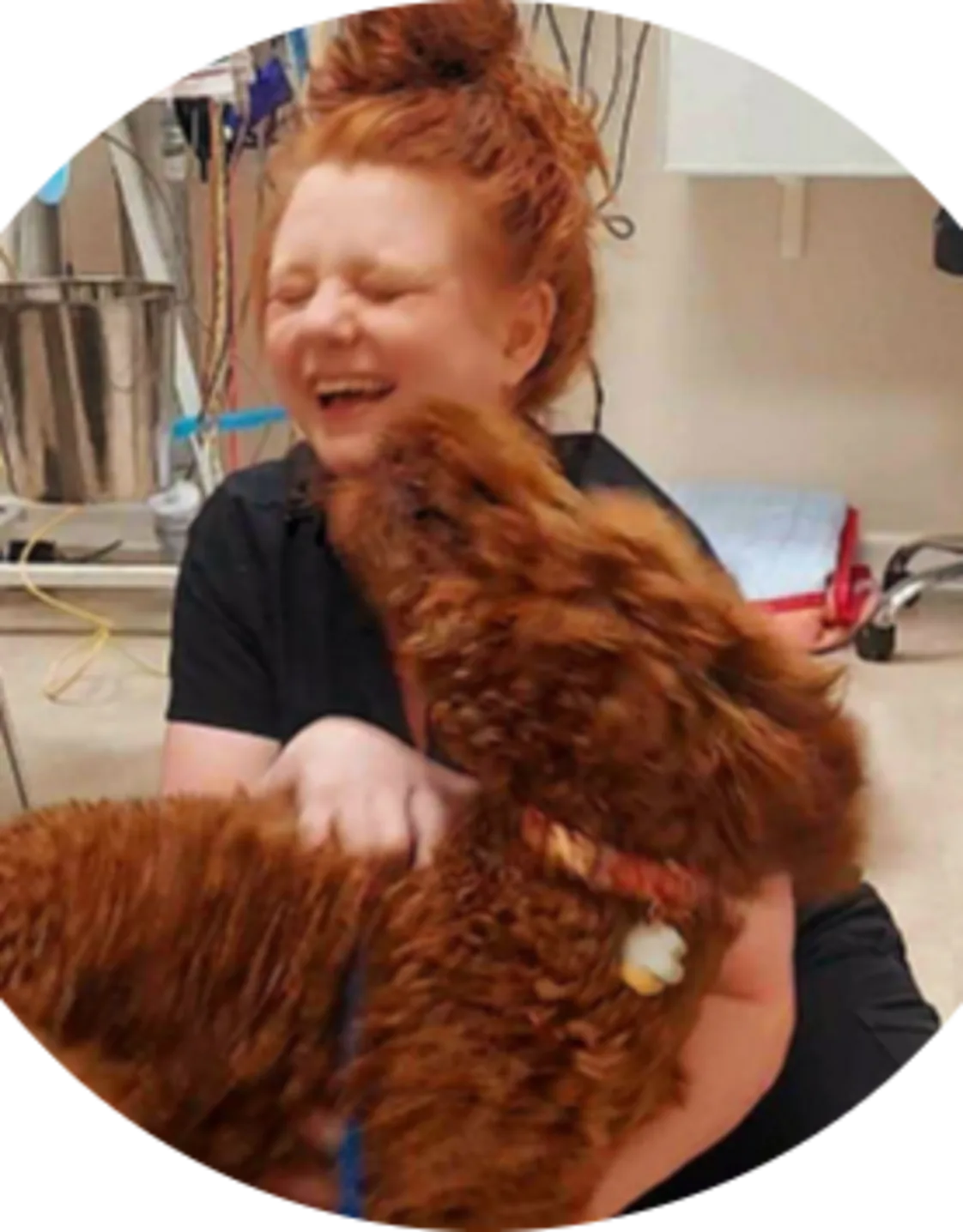 Picture of Dr. Angela Cox embracing a brown dog at Lake Chatuge. Picture of Dr. Angela Cox embracing a brown dog at Lake Chatuge.