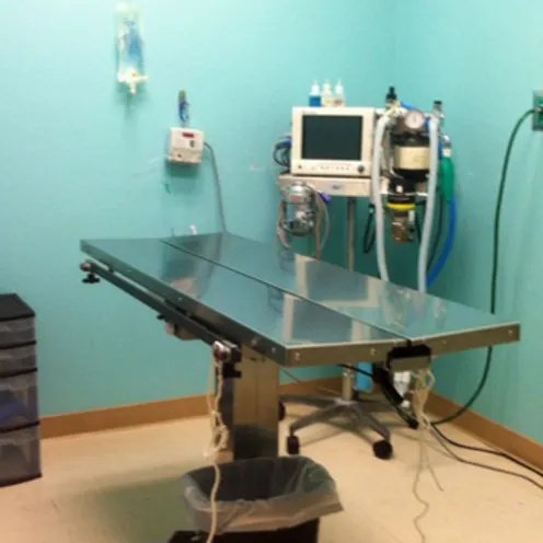Angled view of the surgery operating room with metal operating table