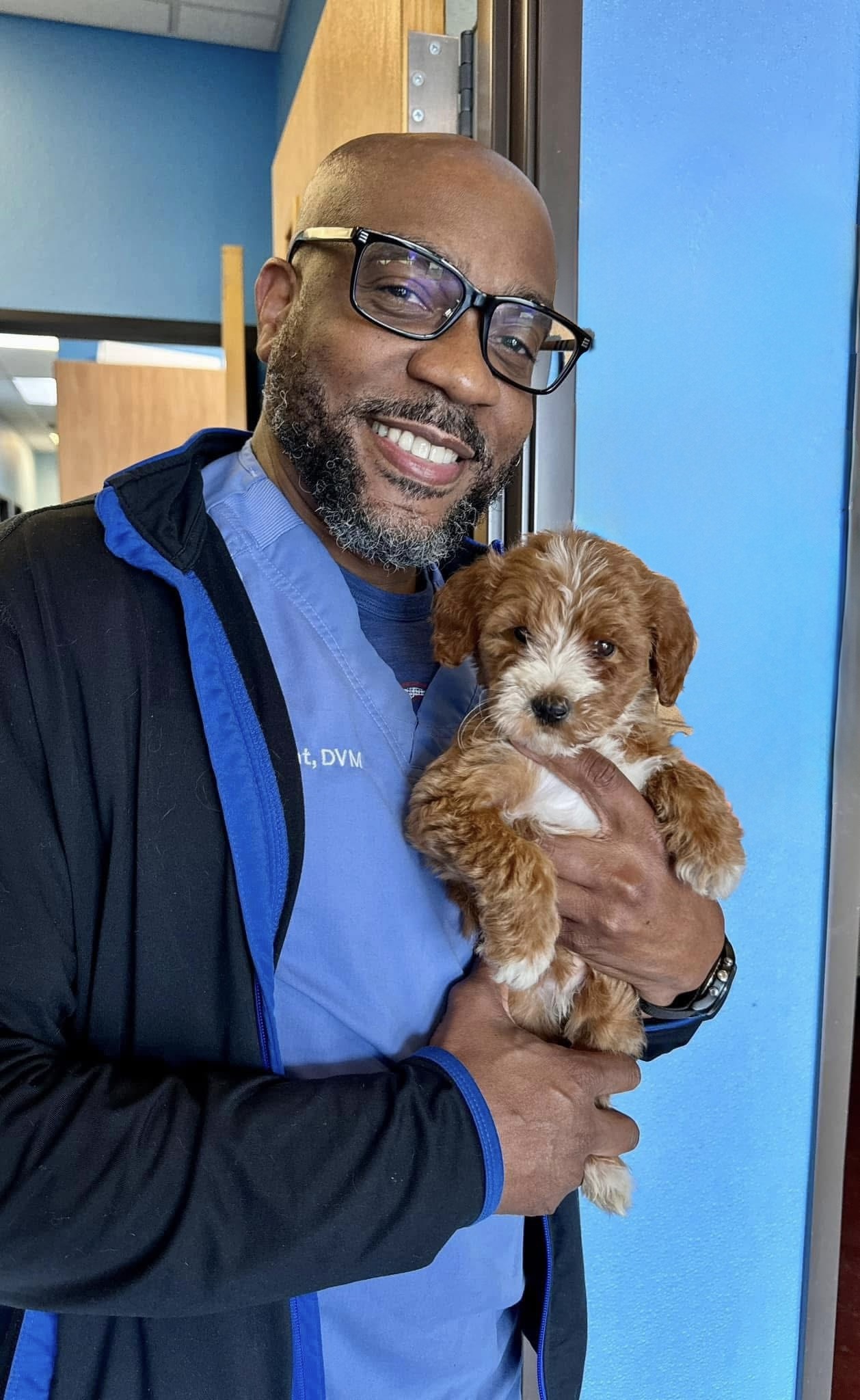 Portrait of Dr. Roderick Gant against a blue wall