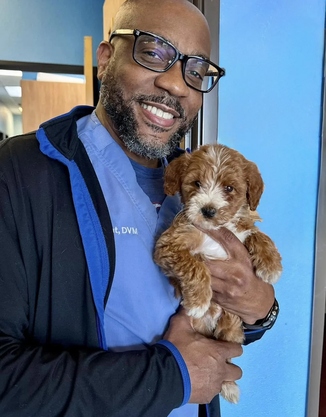 Portrait of Dr. Roderick Gant against a blue wall Portrait of Dr. Roderick Gant against a blue wall