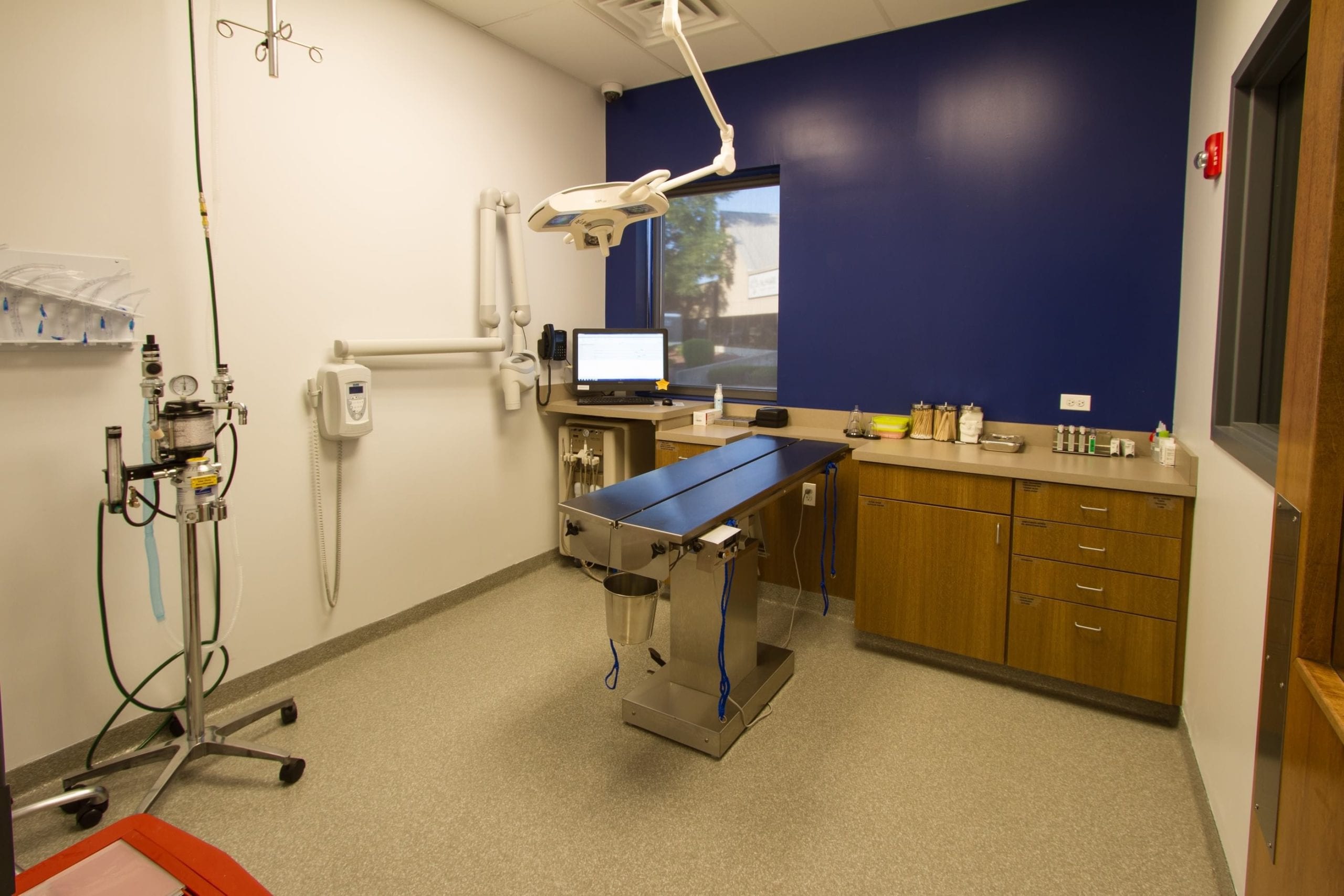 exam room with overhead equipment