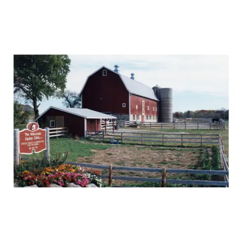 An older photo of the front of WECH's red barn