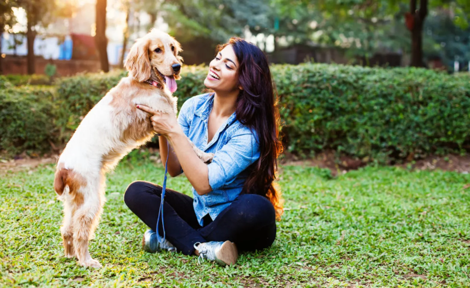 Woman with Dog Standing on Two Legs