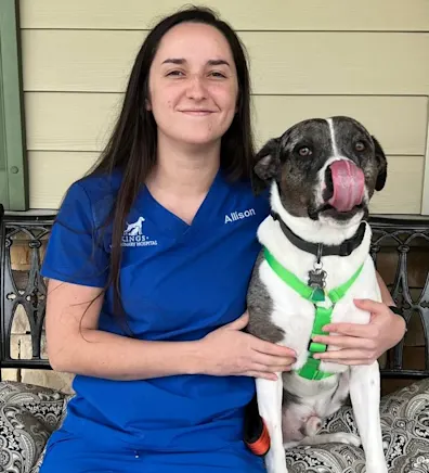 Allison Bedel with a black and white dogs Allison Bedel with a black and white dogs