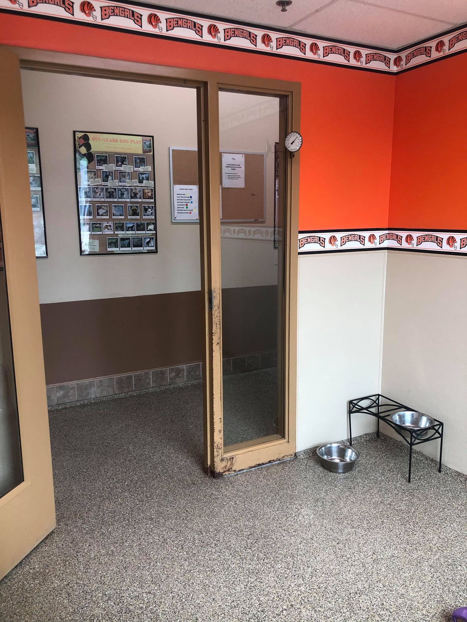 Orange walls, doorway and grainy floor