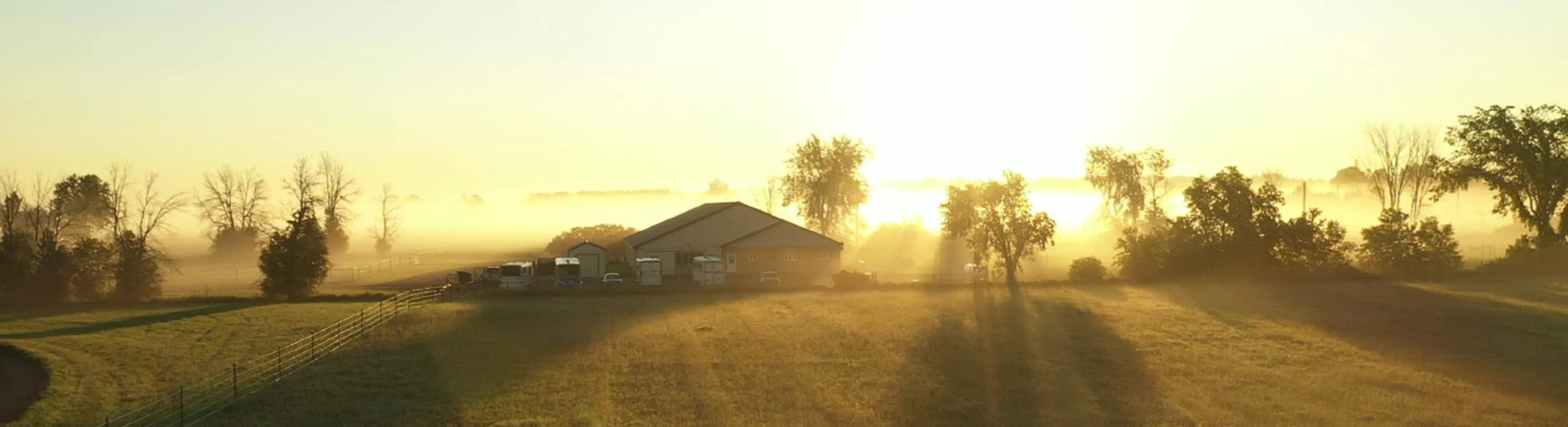 Zoomed out view of Russell Equine Veterinary Service building and pastures.