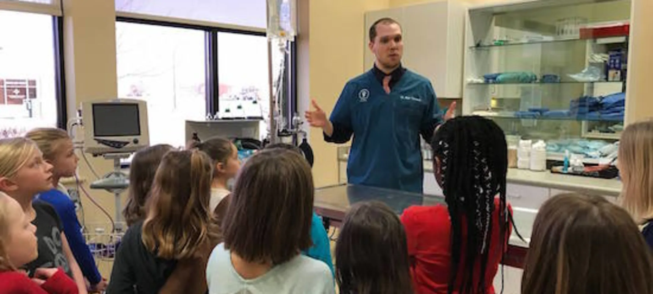 Staff member teaching kids Staff member teaching kids