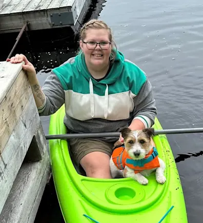 Amber in a kayak with a dog Amber in a kayak with a dog