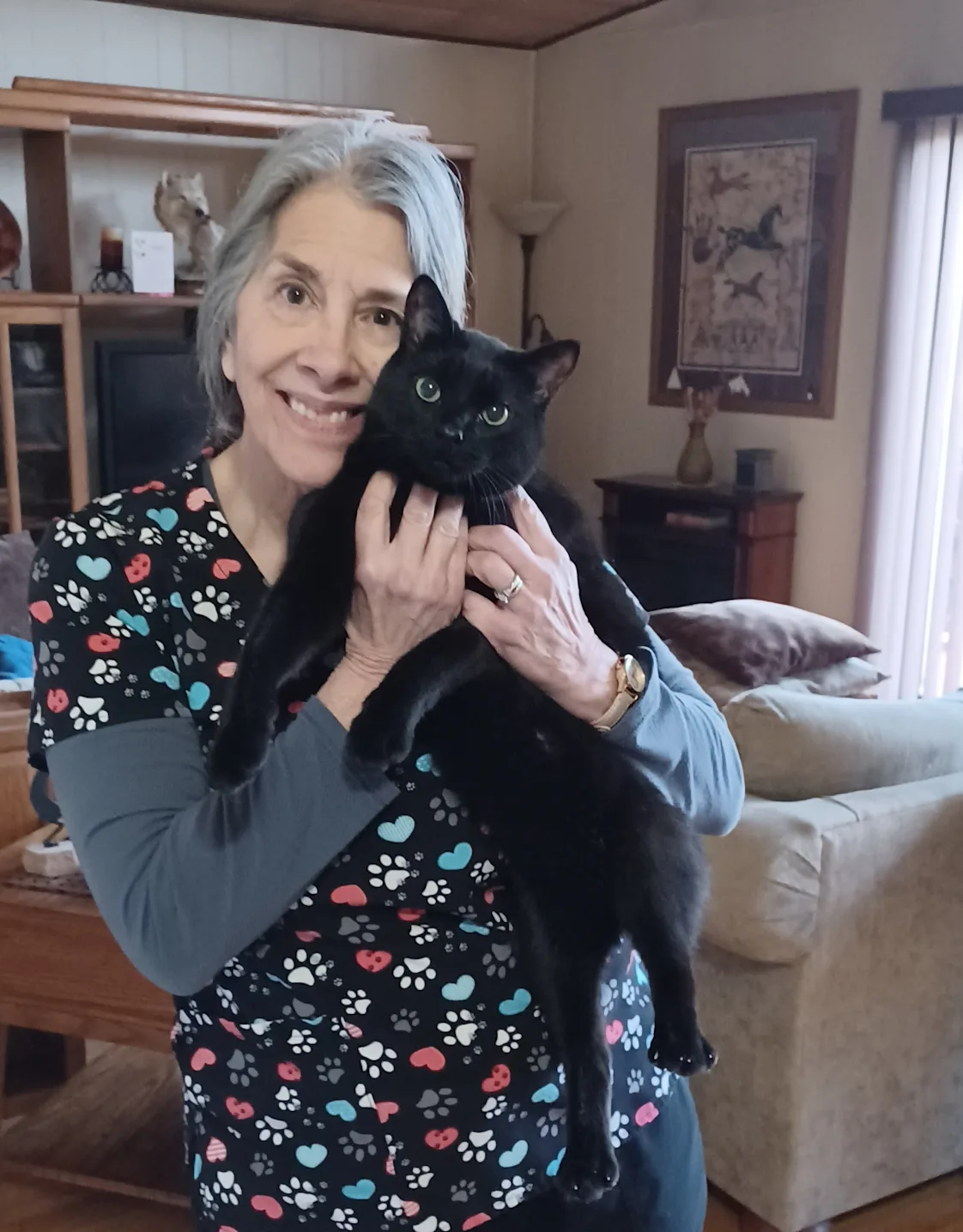 Christine Dobroth - Practice Manager holding a white cat Christine Dobroth - Practice Manager holding a white cat