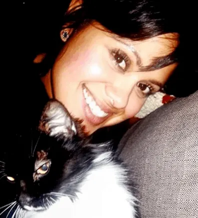 Sirena's staff photo from Riverside Animal Hospital South cuddling cat