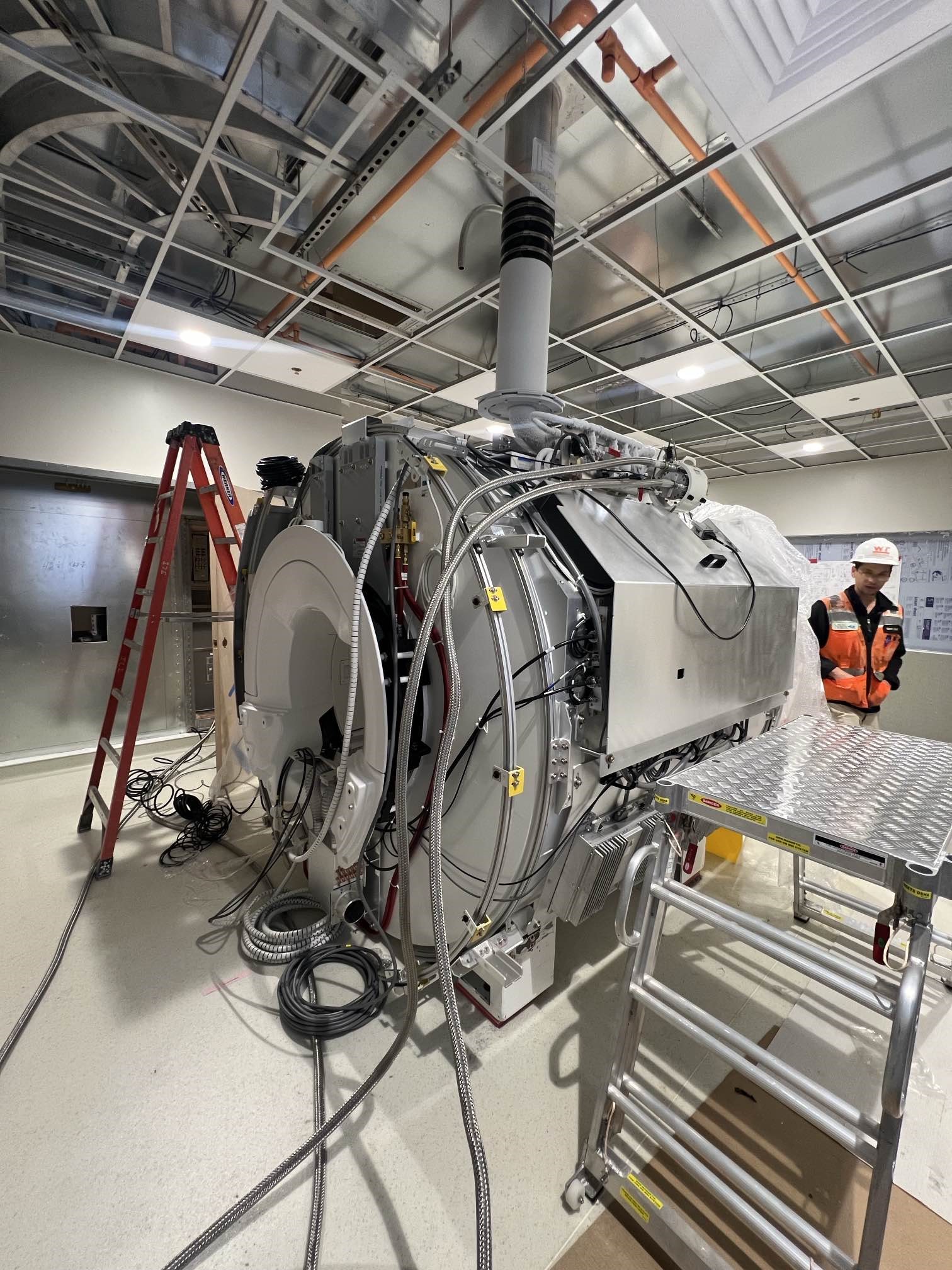 Construction crew setting up MRI machine
