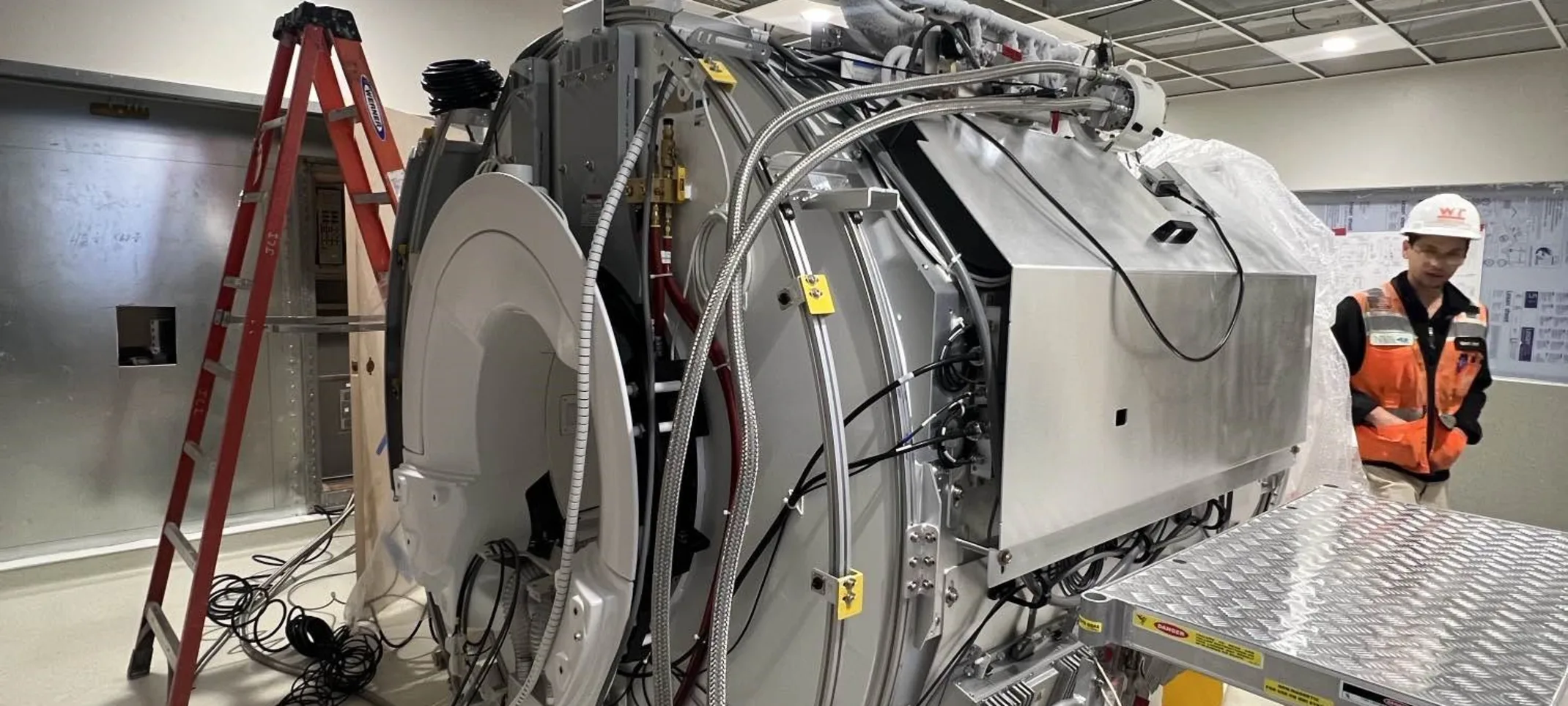 Construction crew setting up MRI machine Construction crew setting up MRI machine