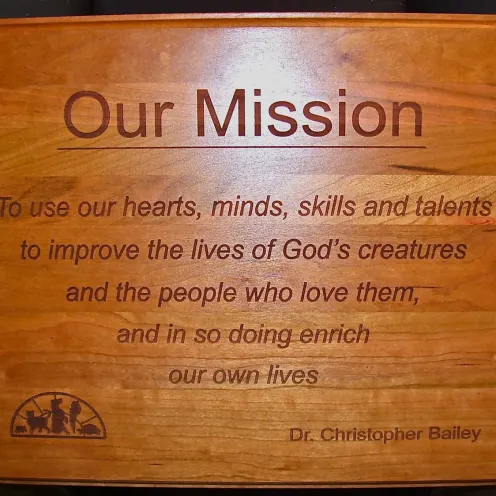  New Baltimore Animal Hospital's Mission Statement on a wooden plack.