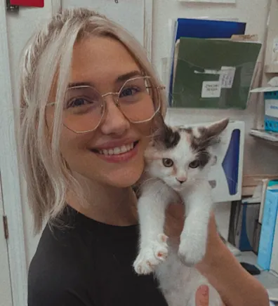 Alexis holding a small dog Alexis holding a small dog