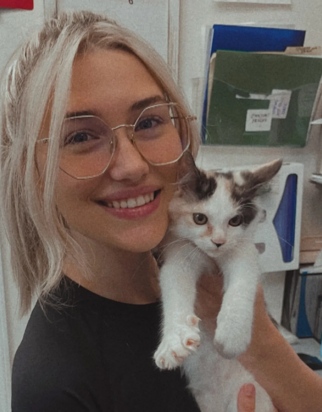 Alexis holding a small dog Alexis holding a small dog