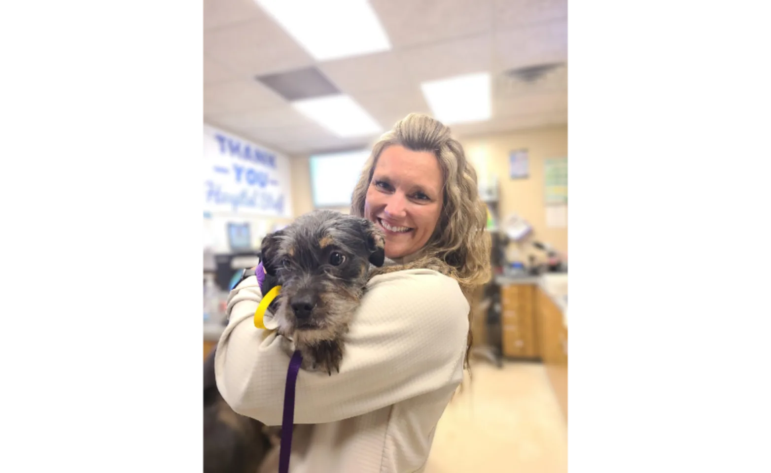 Dr. Brink holding a dog Dr. Brink holding a dog