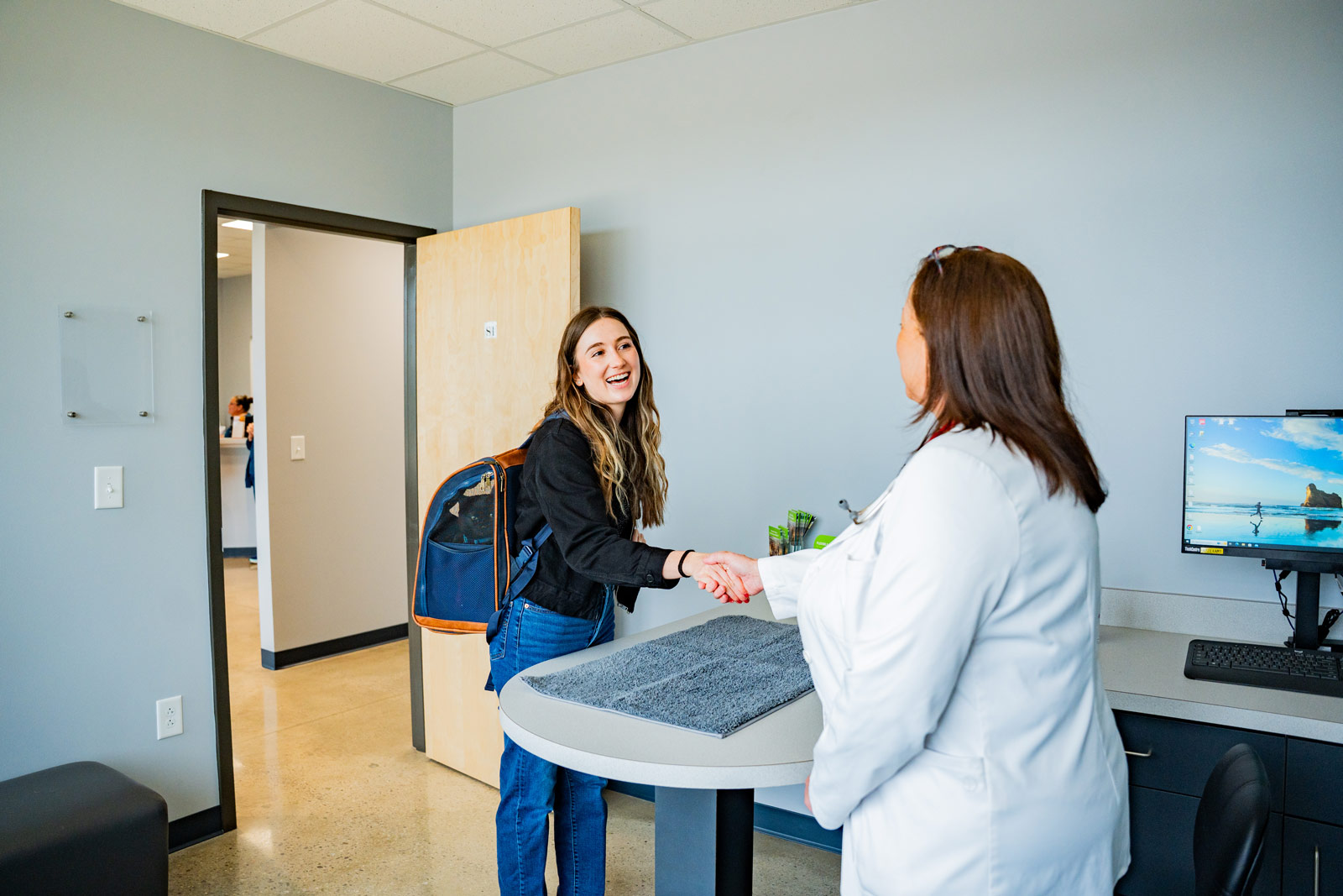 Pet parent reading pamphlet in lobby