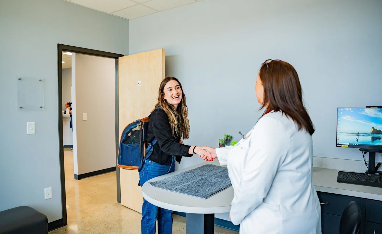 Pet parent reading pamphlet in lobby Pet parent reading pamphlet in lobby