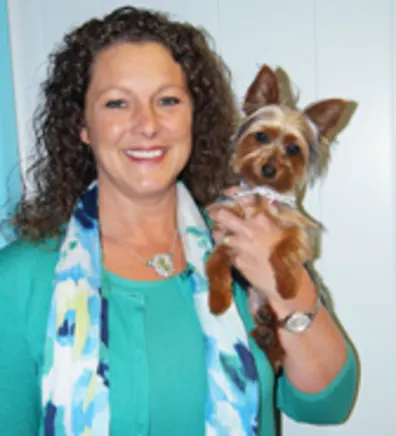 Tobi Burnett with a tiny dog Tobi Burnett with a tiny dog