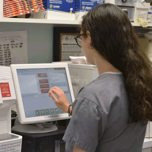 technician using lab equipment at Hidden Valley Animal Hospital