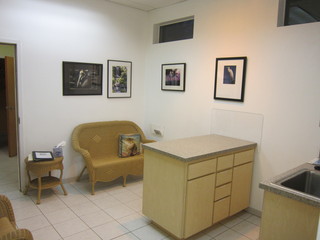 Sitting area and exam table in examination room at Quail Hollow Animal Hospital