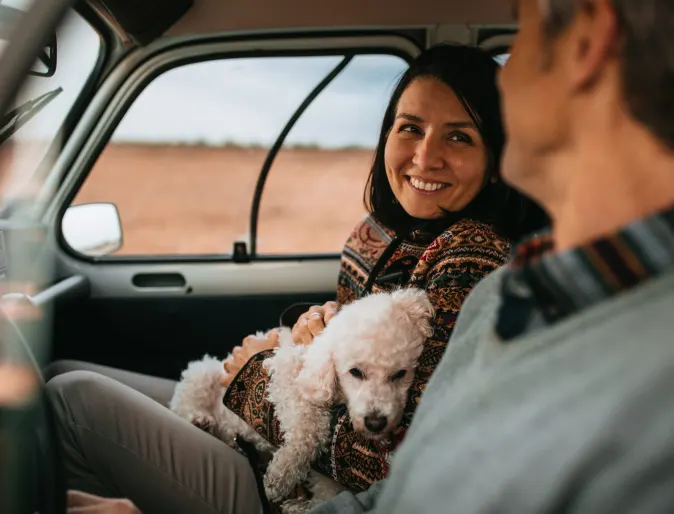 Couple in Car with dog