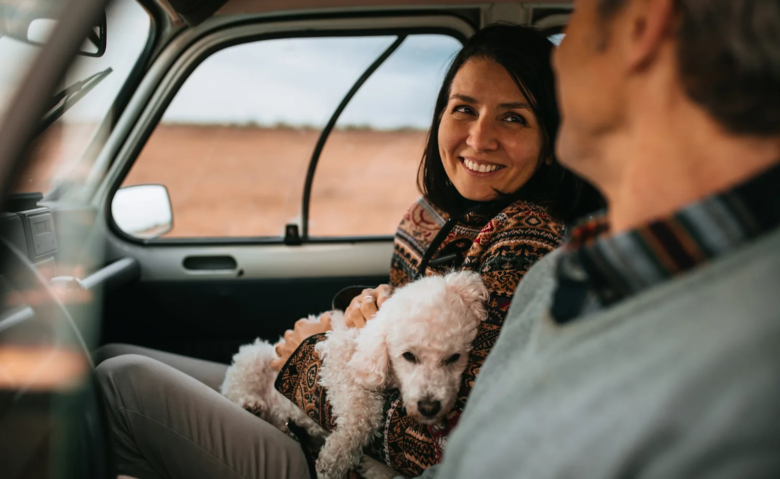 Couple in Car with dog