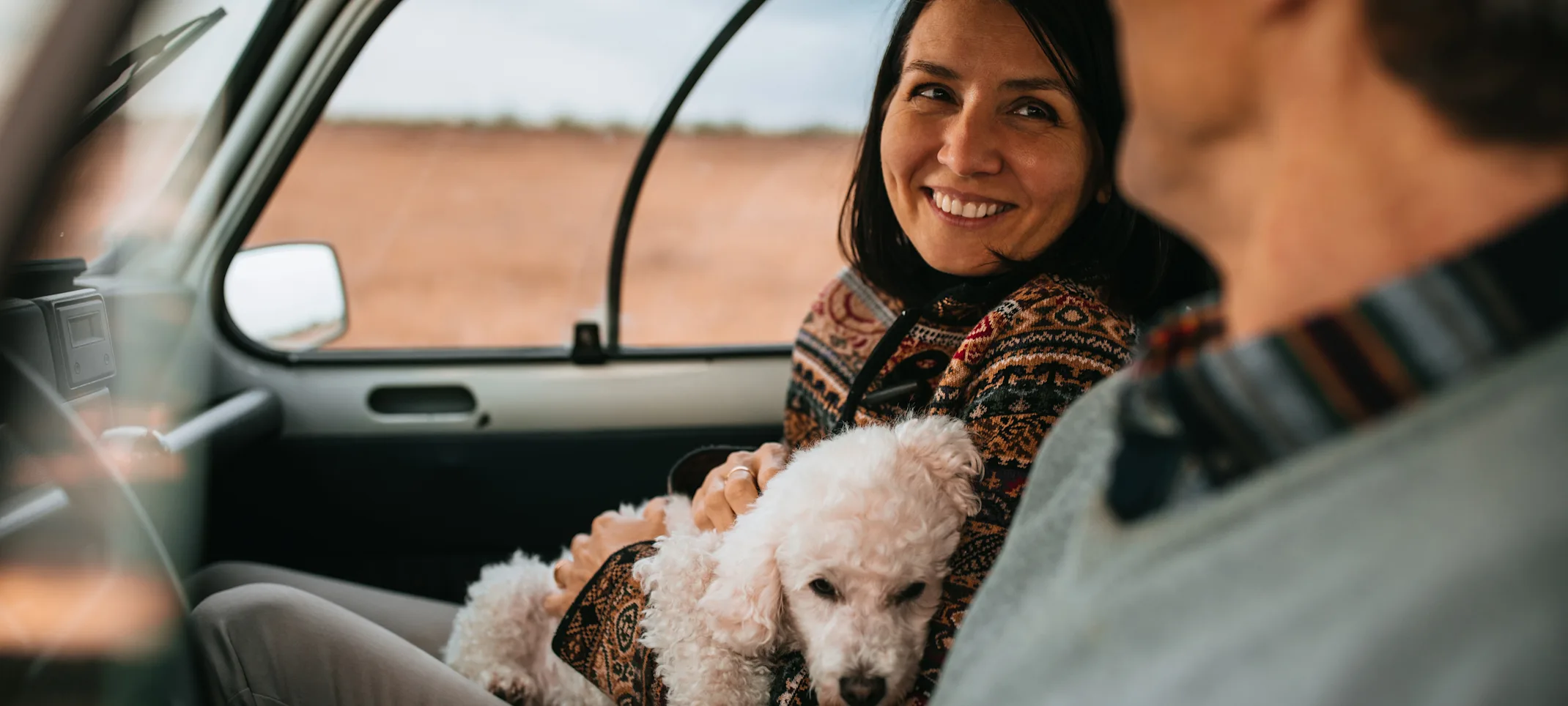 Couple in Car with dog