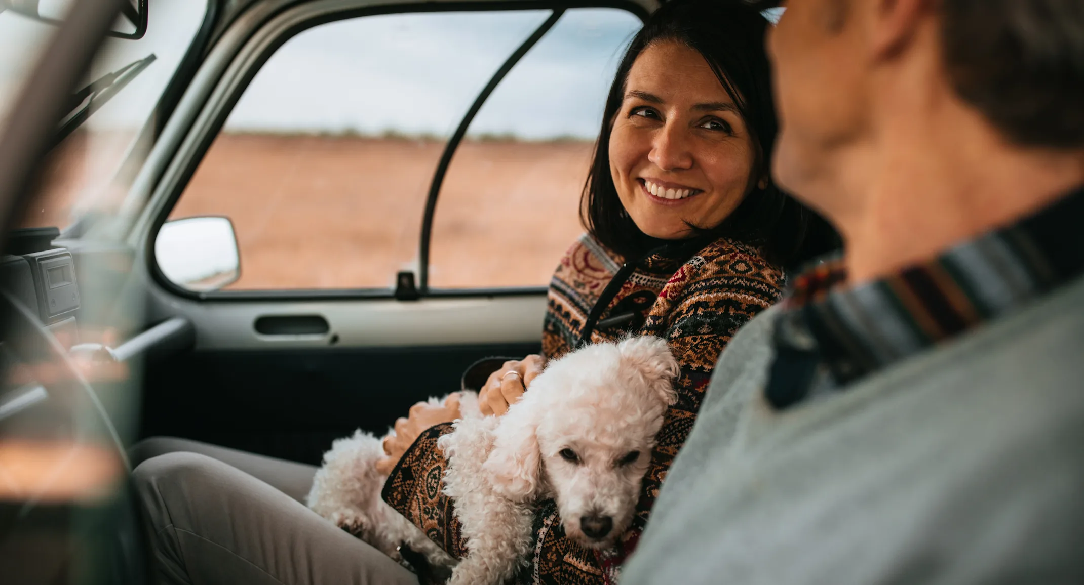 Couple in Car with dog