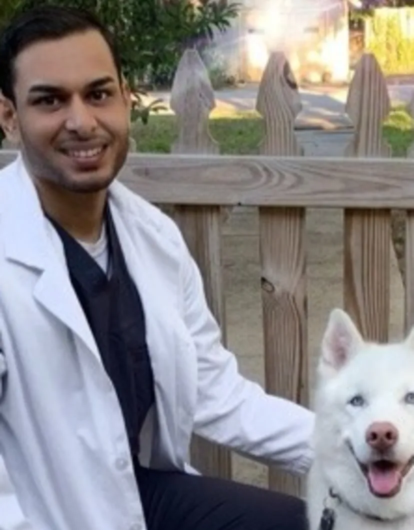 Dr. Rik from Waterford Lakes Animal Hospital with a white husky