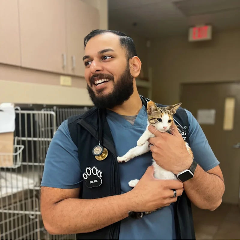 Dr. Rik from Waterford Lakes Animal Hospital with a white husky Dr. Rik from Waterford Lakes Animal Hospital with a white husky