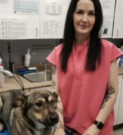 Krista next to a dog Krista next to a dog