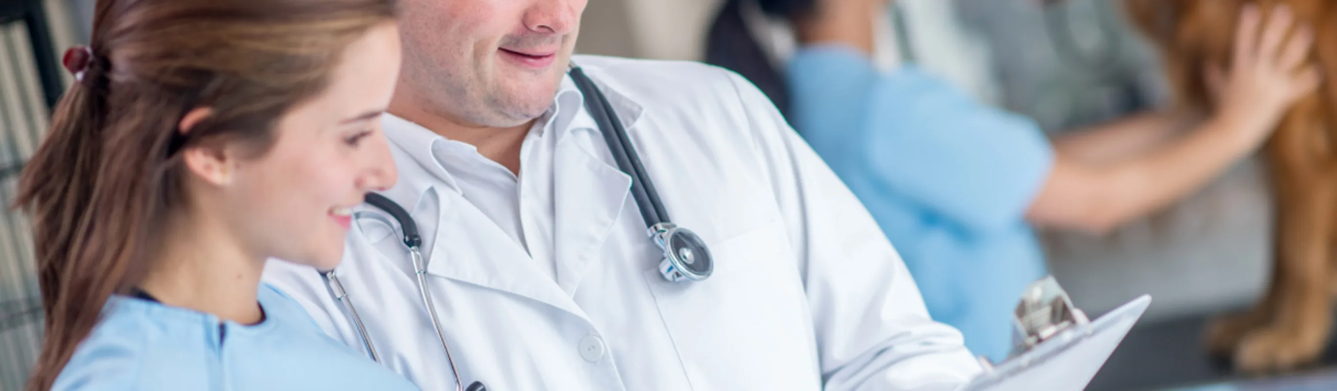 Doctors looking at a checklist. Doctors looking at a checklist.