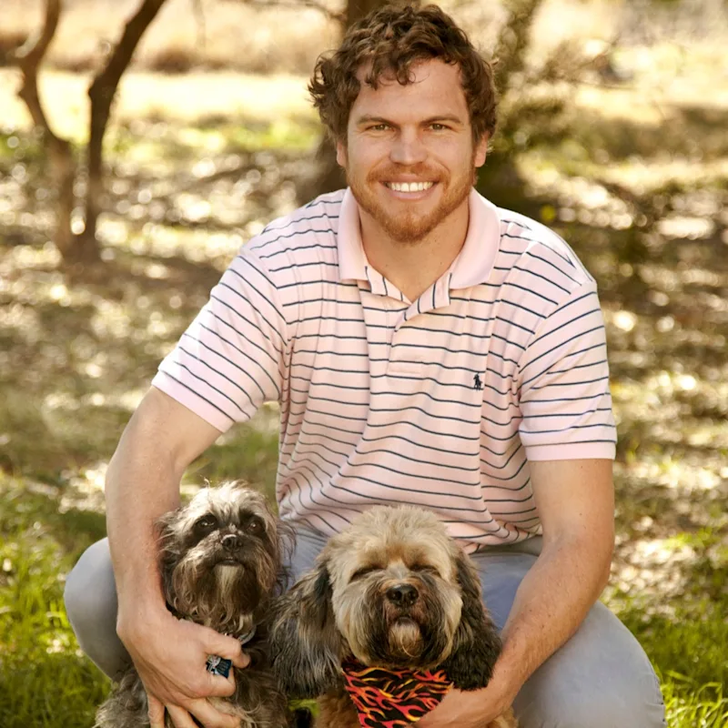 Dr. Frank Shuman IV with Two Dogs Dr. Frank Shuman IV with Two Dogs