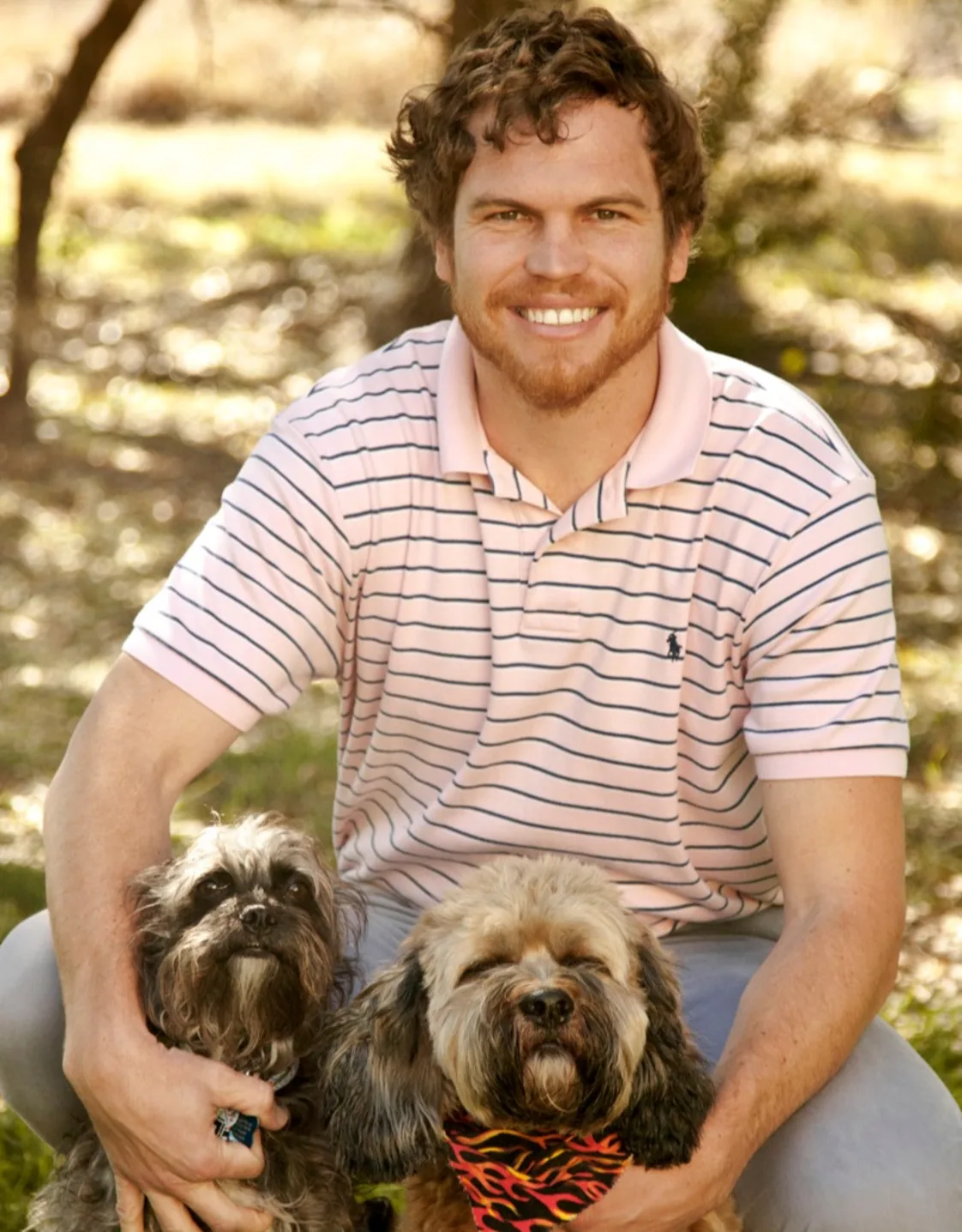 Dr. Frank Shuman IV with Two Dogs Dr. Frank Shuman IV with Two Dogs