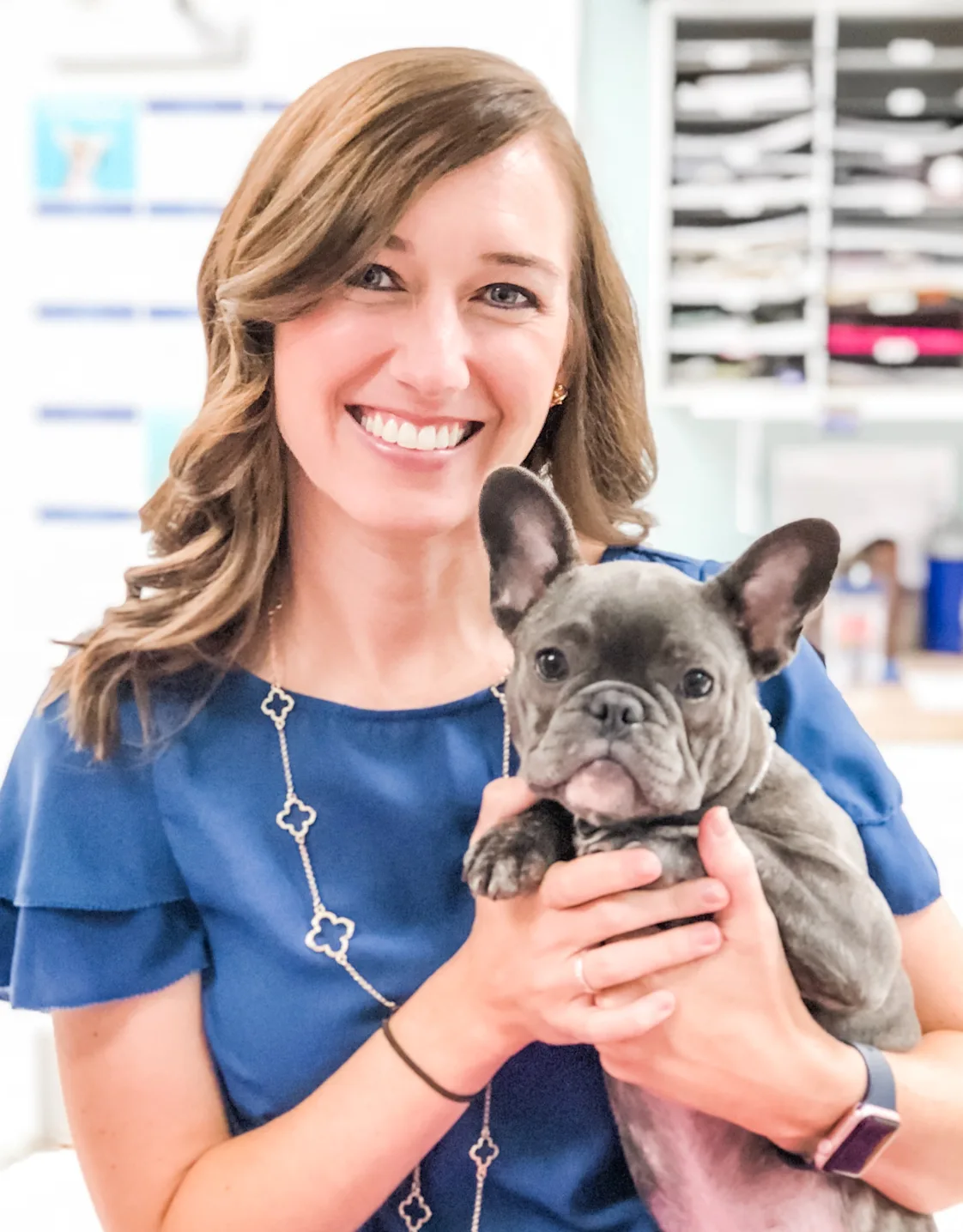 Marian Rowland smiling holding a grey French Bull Dog Marian Rowland smiling holding a grey French Bull Dog