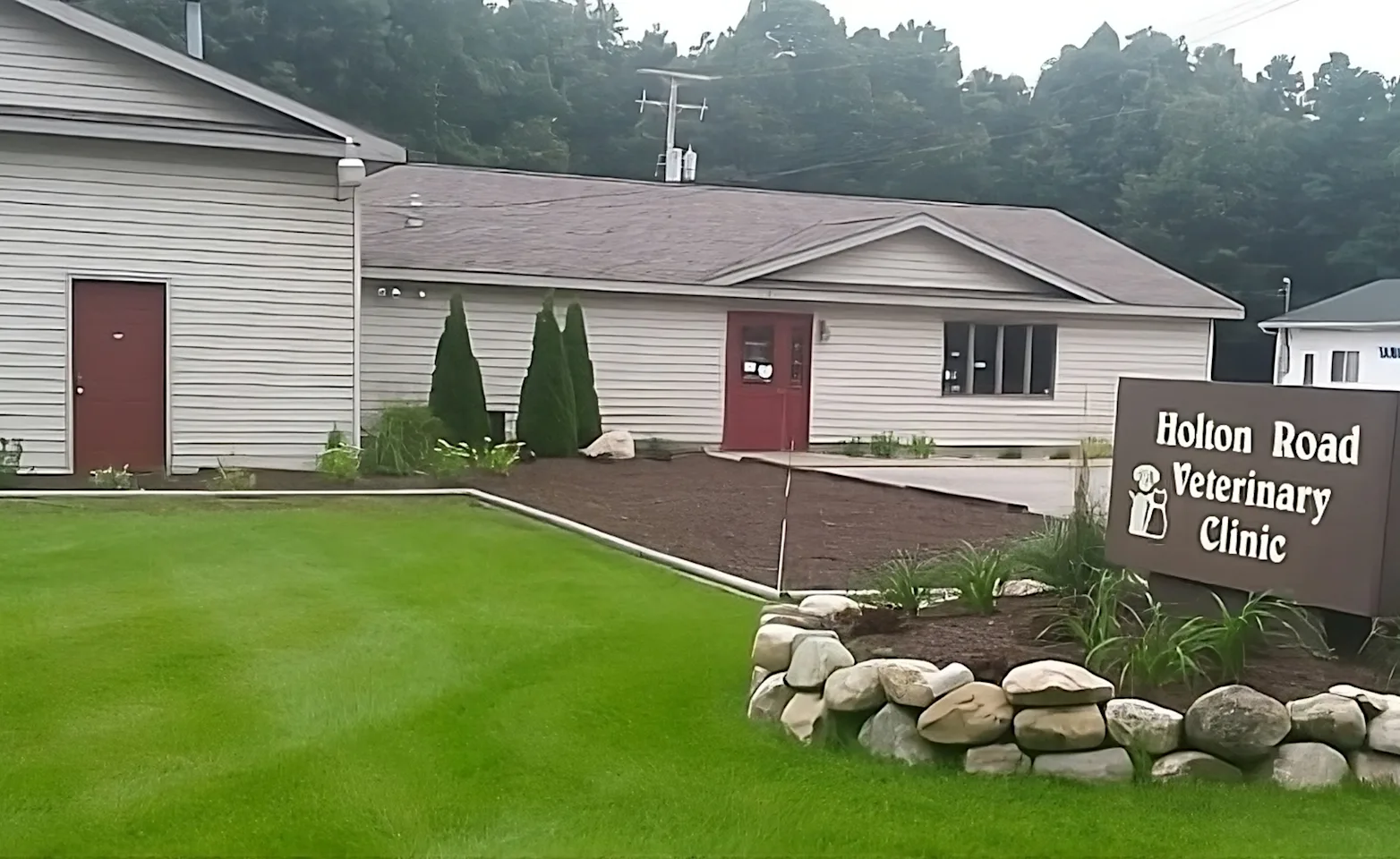 Exterior of Holton Road Veterinary Clinic with sign out front