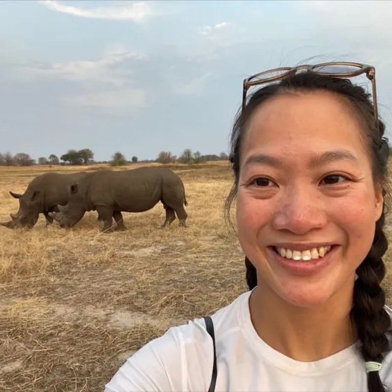 Staff photo of Dr. Cara Yu with two Rhinos in the background Staff photo of Dr. Cara Yu with two Rhinos in the background