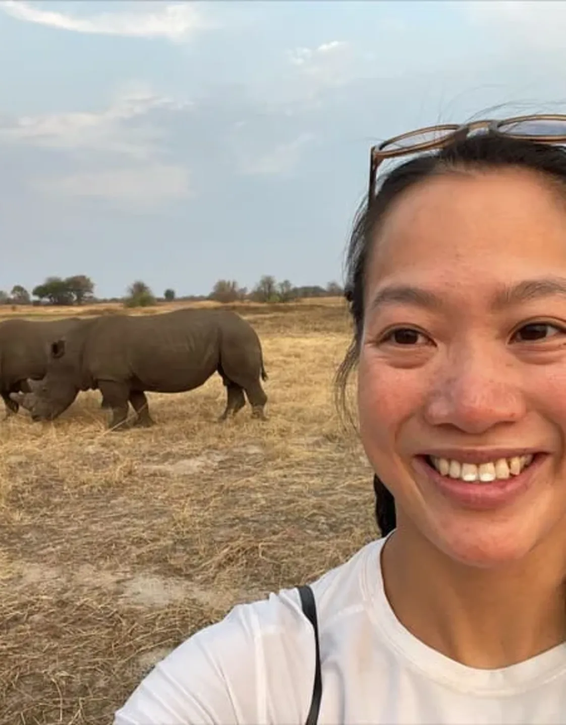 Staff photo of Dr. Cara Yu with two Rhinos in the background Staff photo of Dr. Cara Yu with two Rhinos in the background