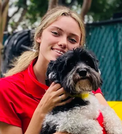 Ambria B. in red shirt with a black dog Ambria B. in red shirt with a black dog
