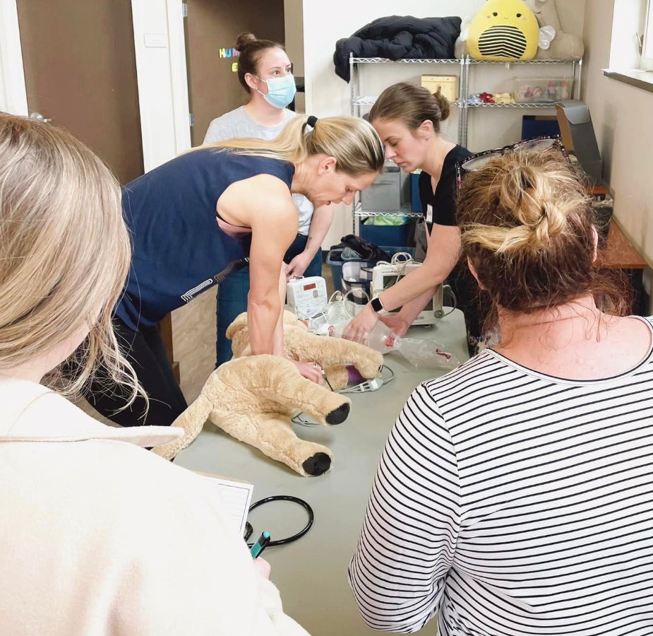 Team members performing recover CPR training