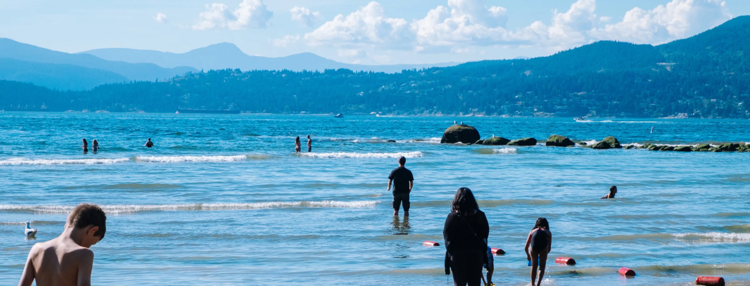 Families swimming at Stanley Park in Vancouver Families swimming at Stanley Park in Vancouver