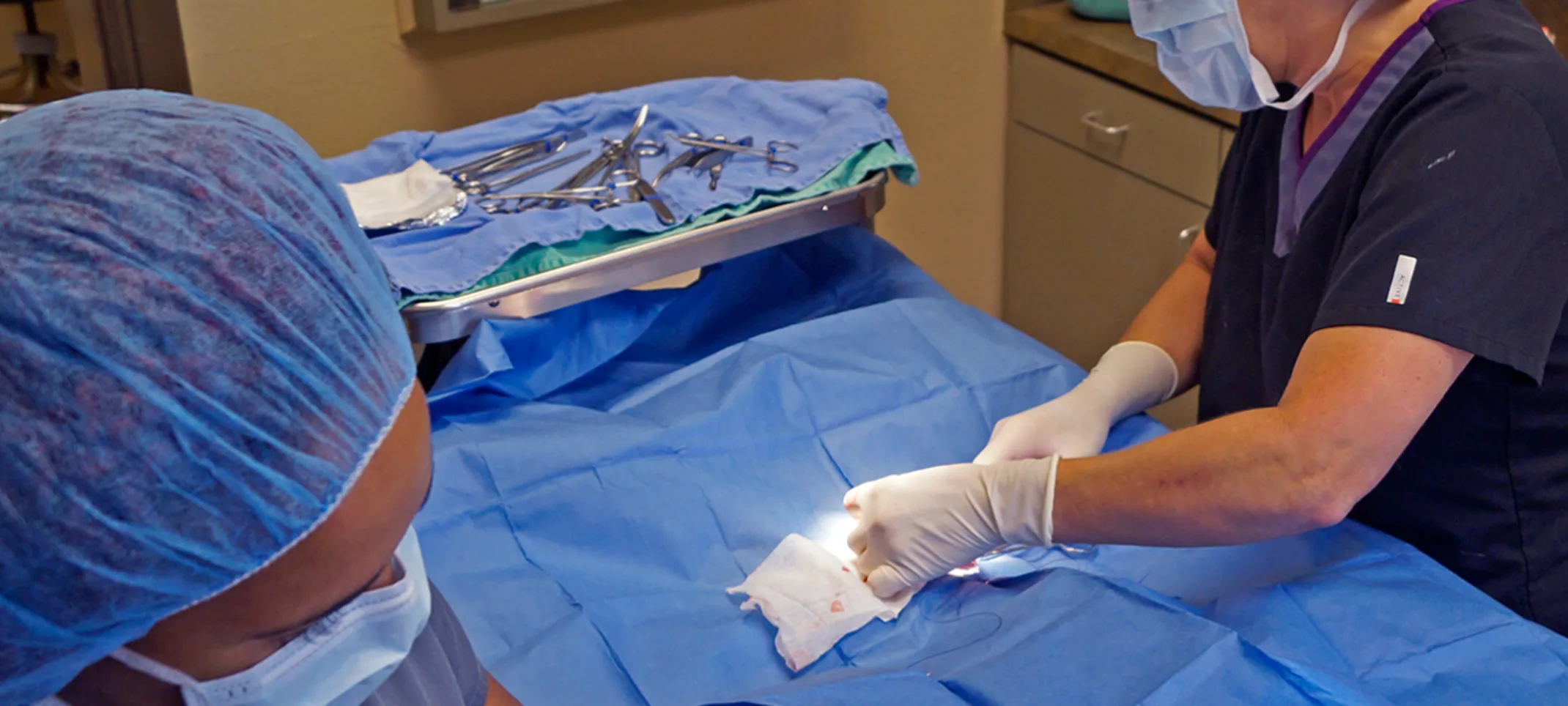 staff administering a surgery staff administering a surgery