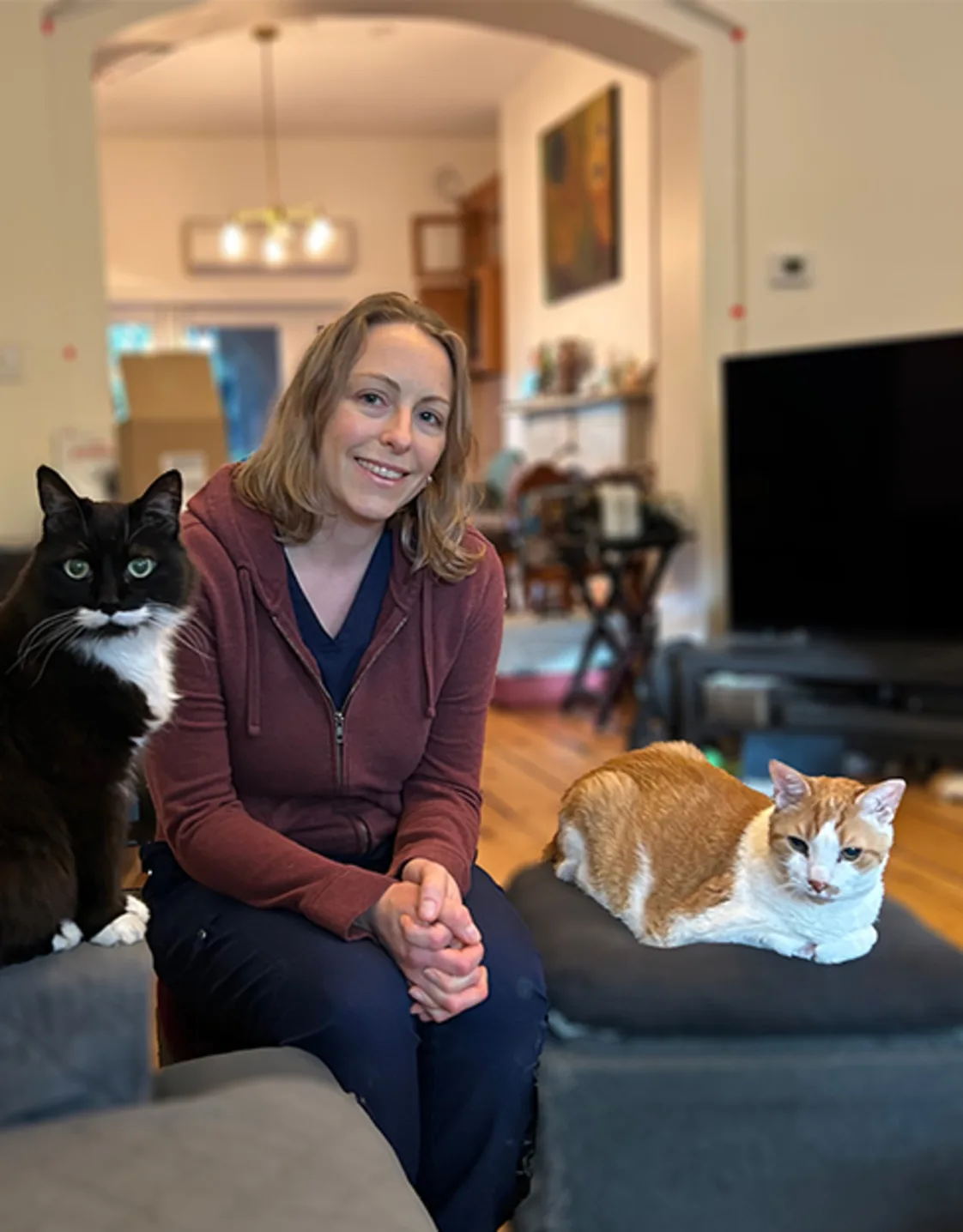 Dr. Catherine Czaya with two cats Dr. Catherine Czaya with two cats