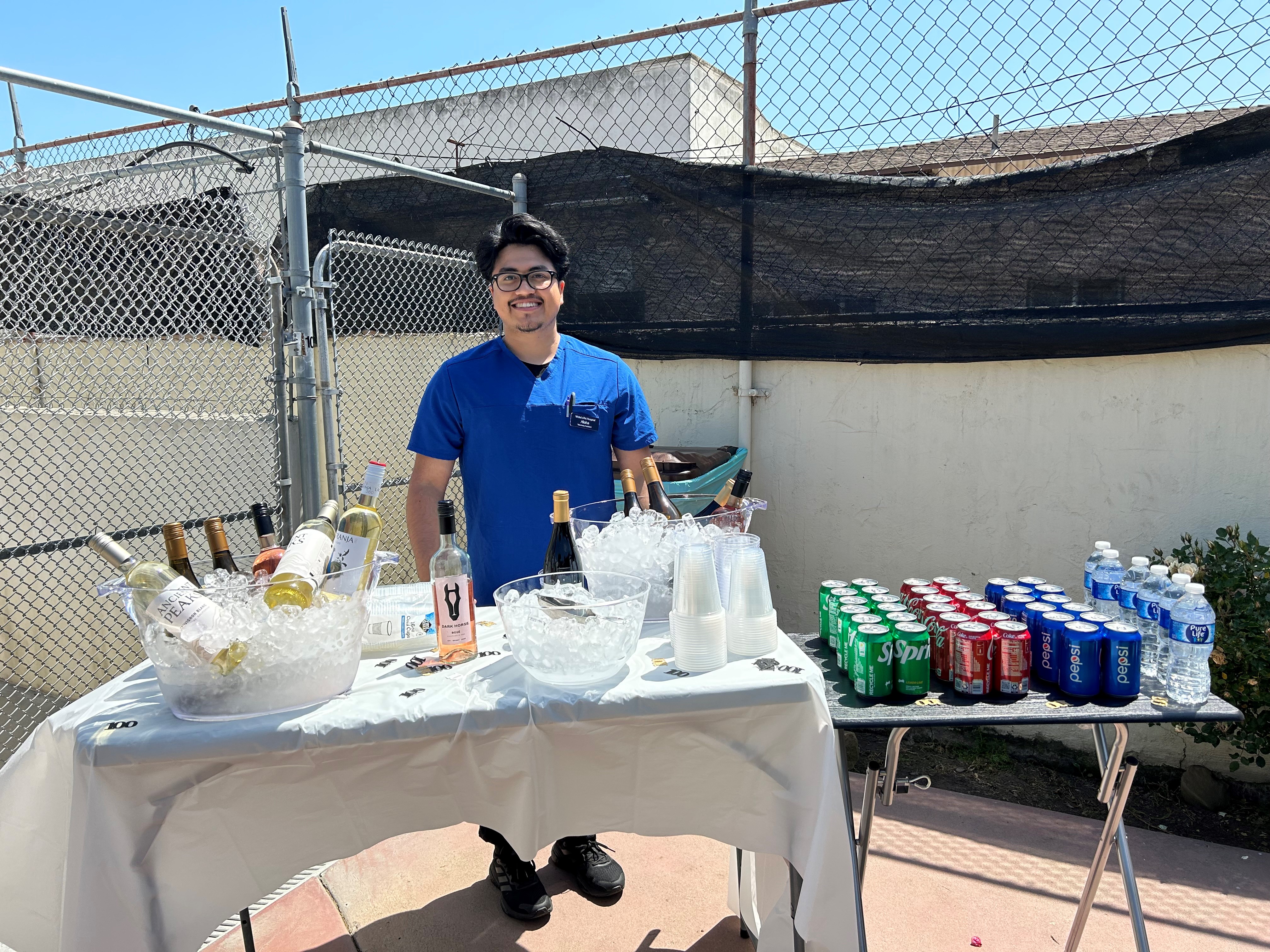 Photo of staff member in front of drinks-Aloha