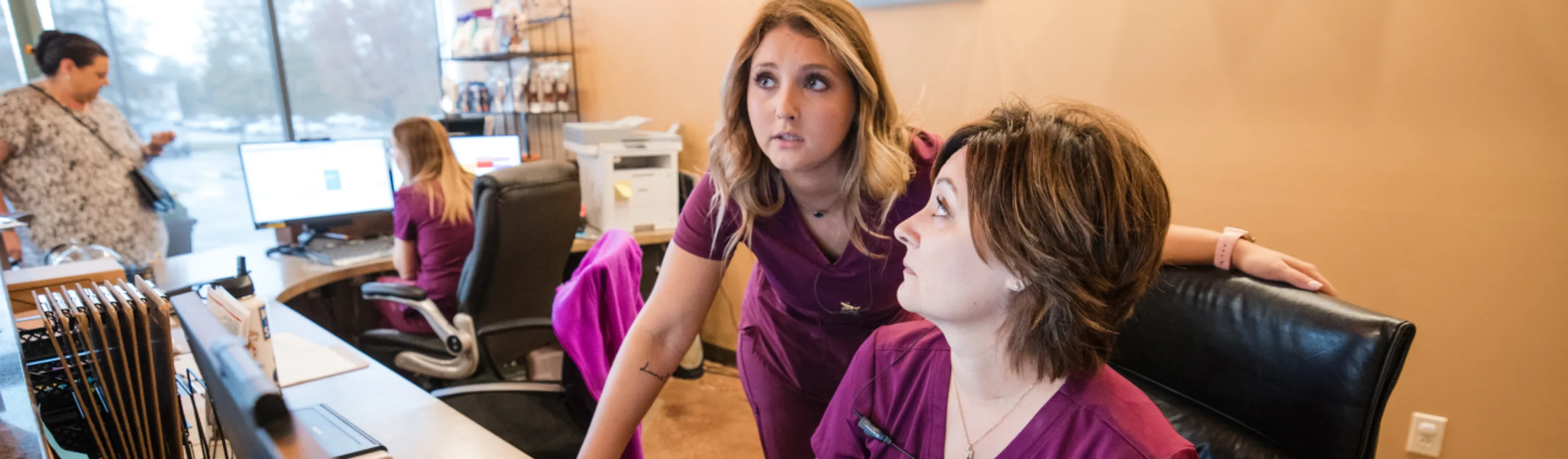 Staff Posing with Dog Staff Posing with Dog