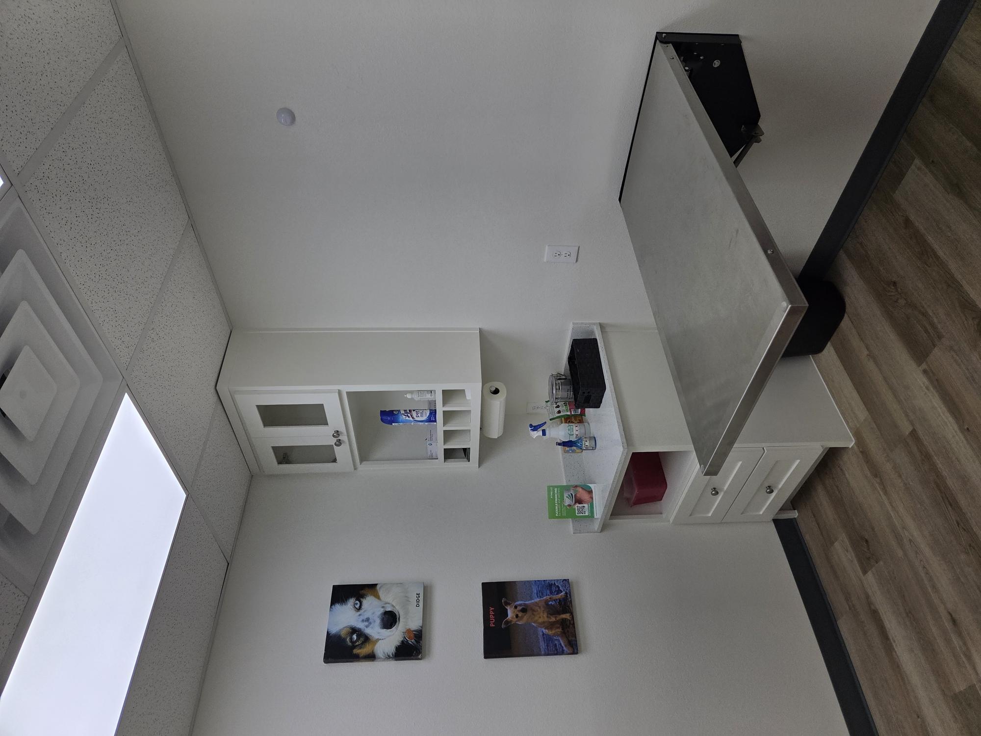 A white room with an examination bed
