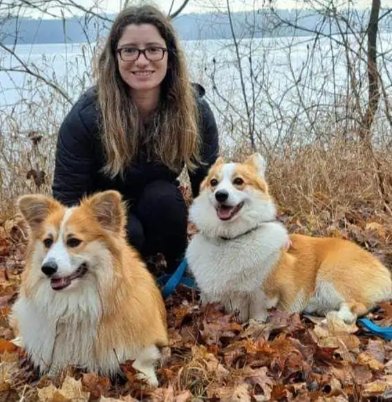Staff photo of Shannon with two corgis