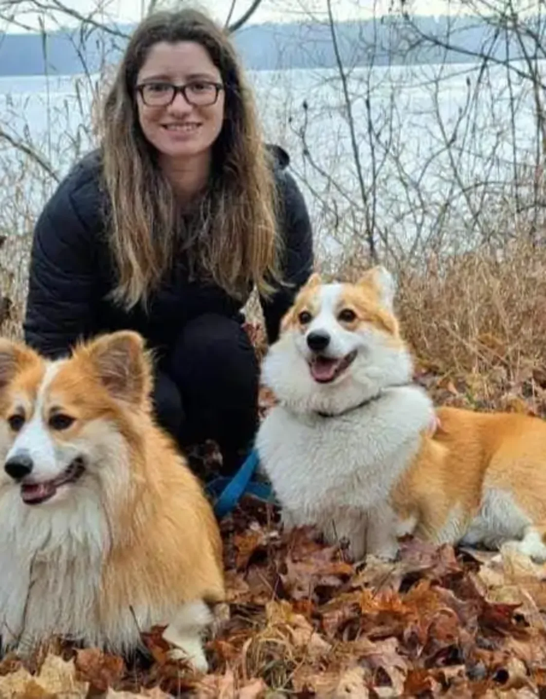 Staff photo of Shannon with two corgis Staff photo of Shannon with two corgis