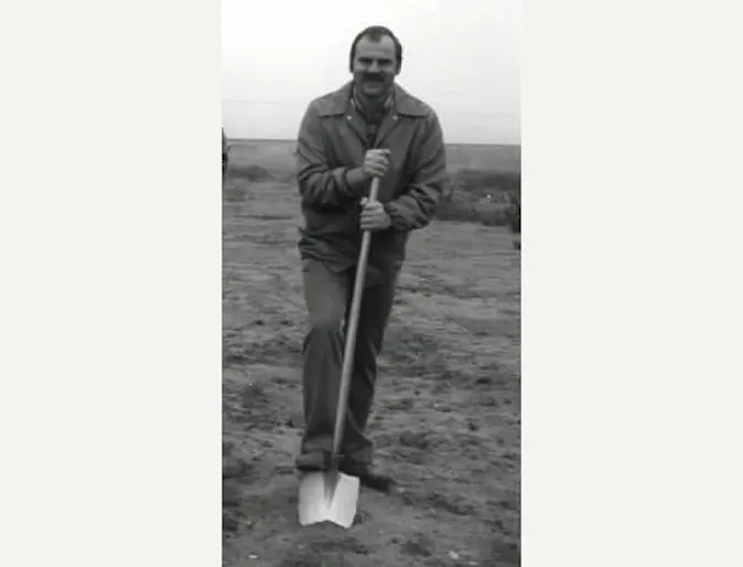 Dr. Duane Schnittker breaking ground with a shovel Dr. Duane Schnittker breaking ground with a shovel